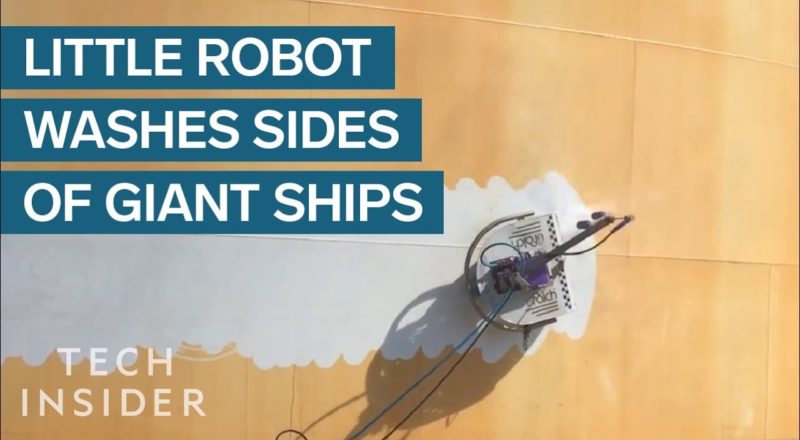 Little Robot Washes Sides Of Giant Ships